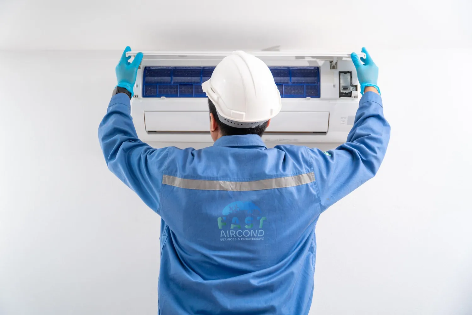 Professional aircon technician working